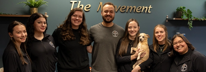 Chiropractor Maple Grove MN Hannah Willford Kevin Jean And Cydney Jean With Team Hannah Willford, Kevin Jean, And Cydney Jean with their staff smiling.