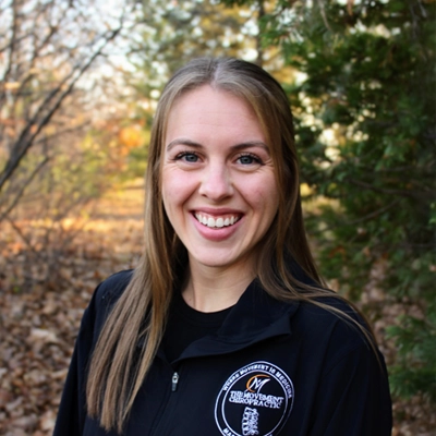 Chiropractor Hannah Willford smiling outside.