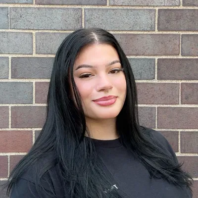 Women with black hair smirking