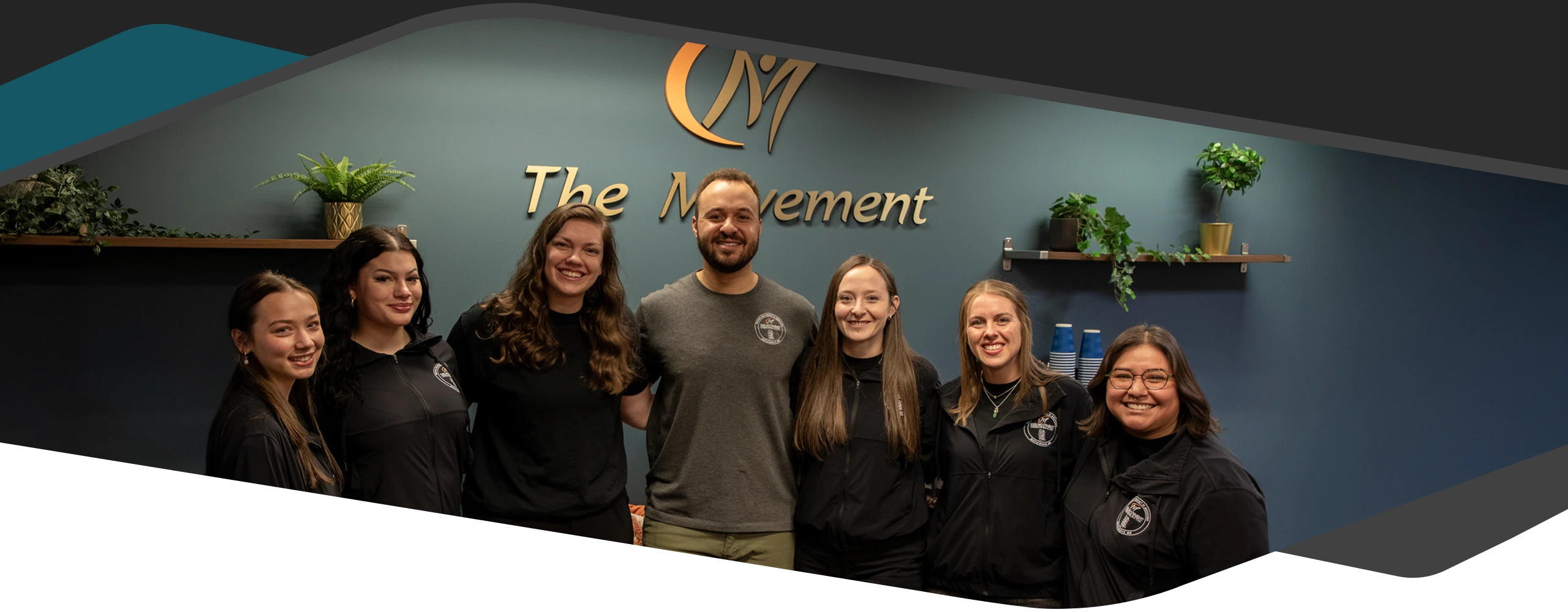 Chiropractor Maple Grove MN Kevin Jean And Cydney Jean With Team USE Kevin Jean And Cydney Jean smiling with their team.