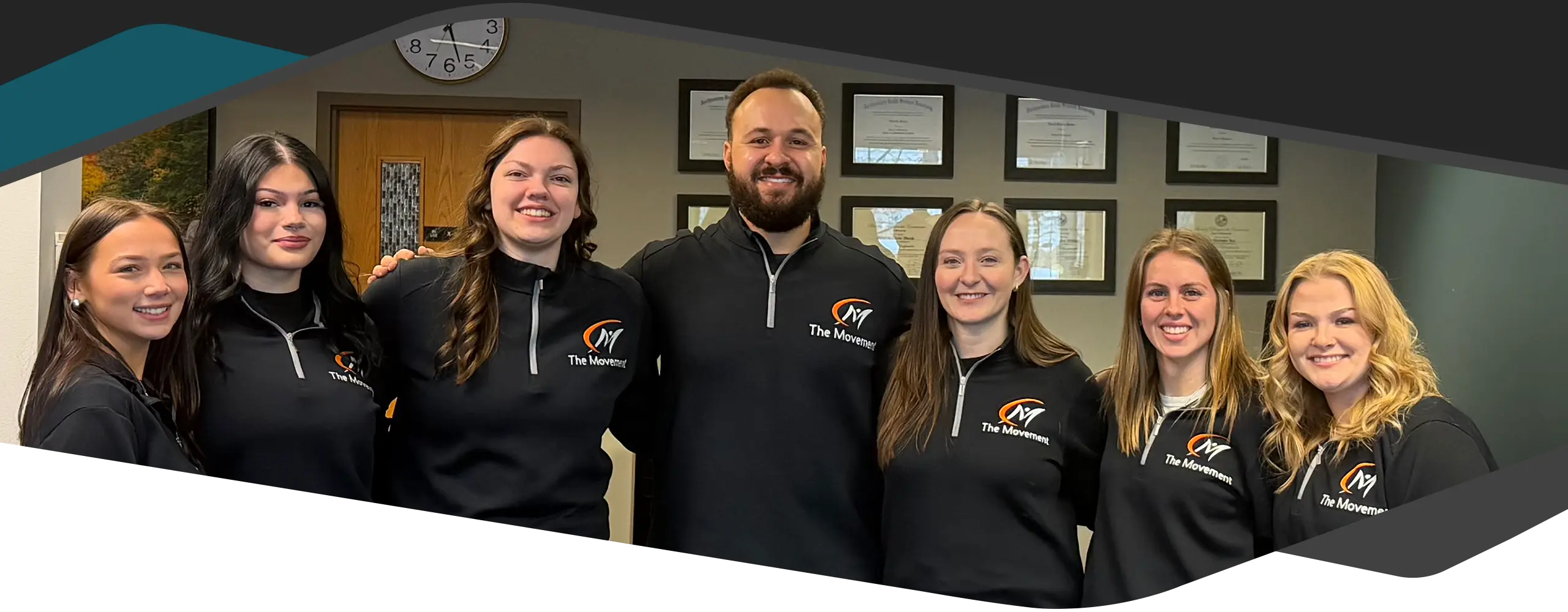 Kevin Jean And Cydney Jean smiling with their team.